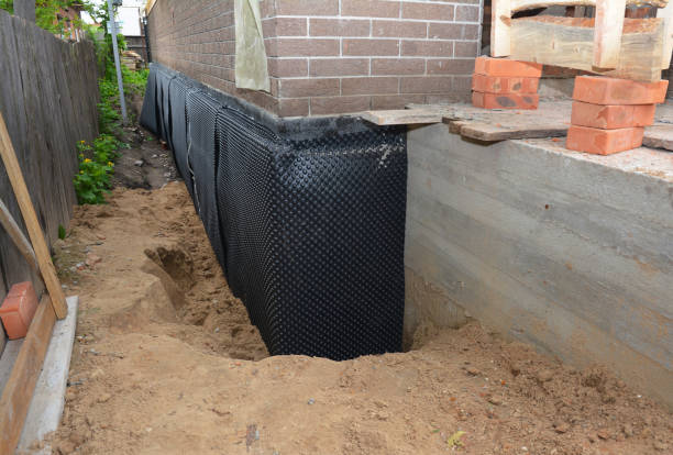Happy homeowners after waterproofing job in Clifton Heights